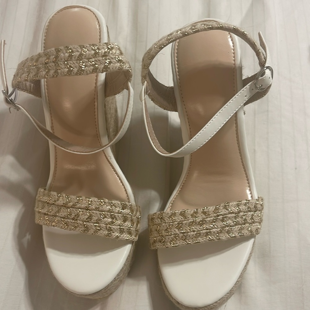 Sexy wedge shoes never worn. Beige in color with 5 inches tall.